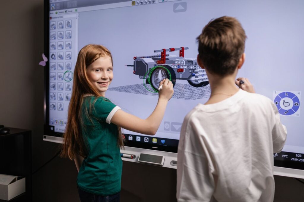 Students learning with an interactive display in a future classroom
